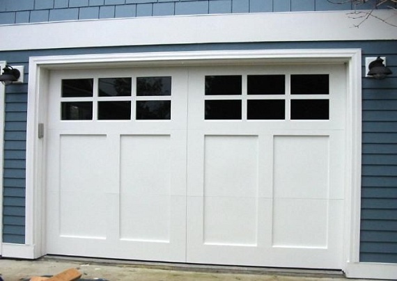 White craftsman carriage-style garage doors